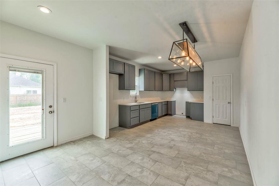 KITCHEN WITH QUARTZ COUNTERTOP,NEW RANGE AND DISHWASHER, 42 INCH CABINETS, LARGE FOOD PANTRY