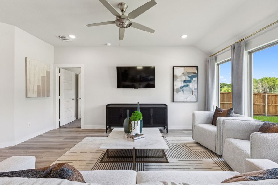 Living Room in the Emmy II home plan by Trophy Signature Homes - REPRESENTATIVE PHOTO