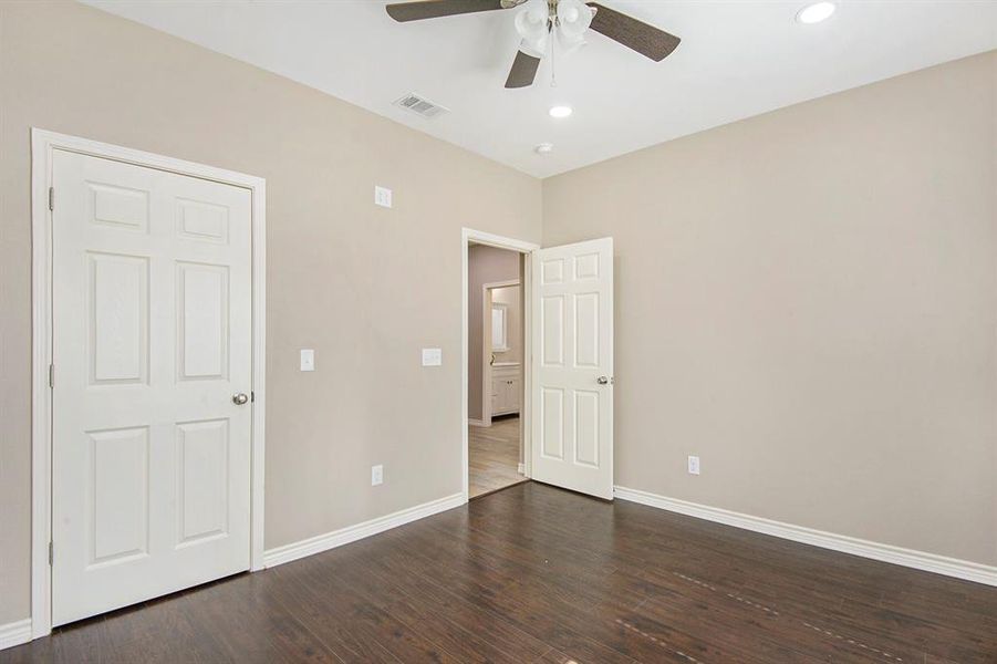 Unfurnished bedroom with dark wood-style floors, recessed lighting, and ceiling fan
