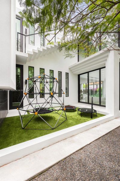 Front exterior of a new home in , Miami Beach, FL, highlighting curb appeal (Image 26). Front exterior of a new home in , Miami Beach, FL, highlighting curb appeal (Image 26).