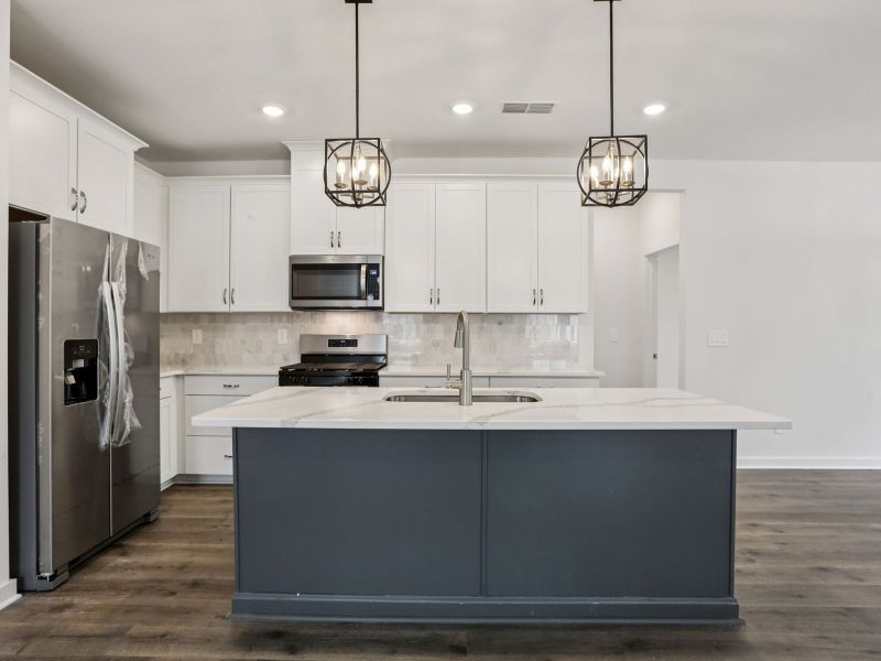 Prep dinner in the kitchen without missing the conversation in the great room.