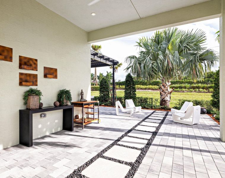 Exterior details and patio area of a home in PGA Village Verano, Port St. Lucie (Image 21).