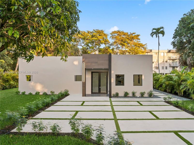 Front exterior of a new home in , North Miami, FL, highlighting curb appeal (Image 31).
