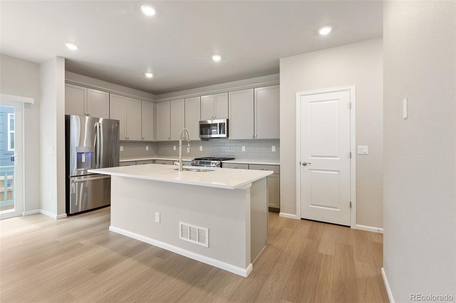Furnished interior view inside a new home in Woodrose at Painted Prairie, Aurora (Image 7).