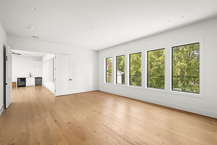 Upstairs flex room is perfect for home gym, golf simulator room, etc.