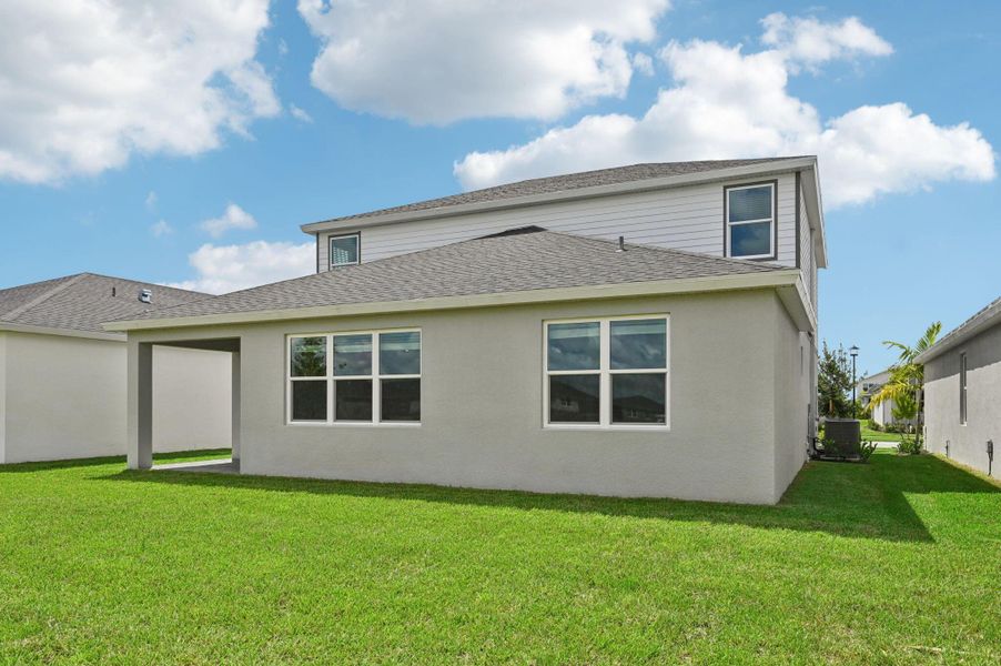 Front exterior of a new home in Brystol at Wylder - Reserve Series, Port St. Lucie, FL, highlighting curb appeal (Image 18).