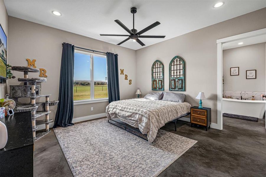 Bedroom with finished concrete flooring, recessed lighting, and ceiling fan Bedroom with finished concrete flooring, recessed lighting, and ceiling fan