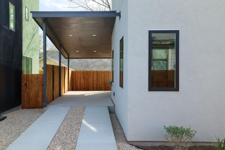 View of side of home with stucco siding