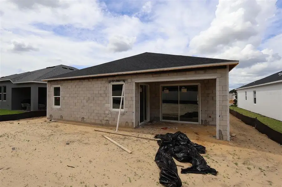 Exterior details and patio area of a home in Emerson Pointe, Apopka (Image 12).