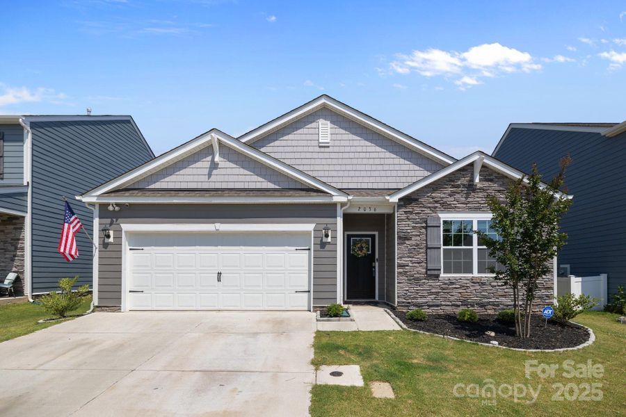 Front exterior of a new home in Secrest Commons, Monroe, NC, highlighting curb appeal (Image 2).