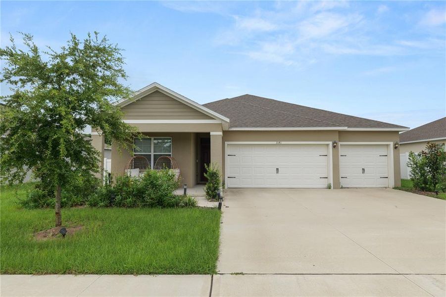 Front exterior of a new home in Wind Meadows South, Bartow, FL, highlighting curb appeal (Image 29). Front exterior of a new home in Wind Meadows South, Bartow, FL, highlighting curb appeal (Image 29).