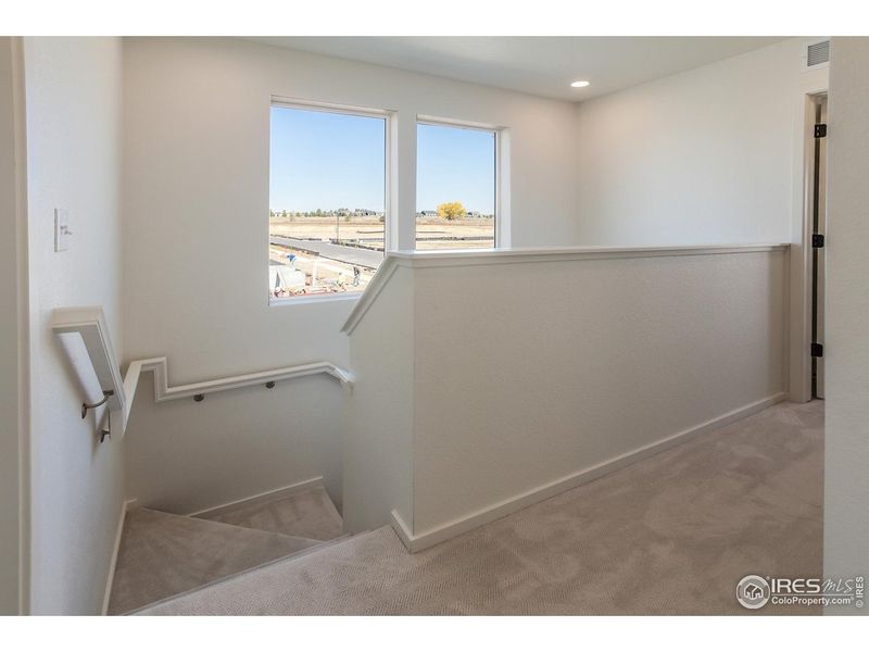 Spacious, unfurnished interior of a new home in Prairie Song Story Collection - Single Family Homes, Windsor (Image 19).