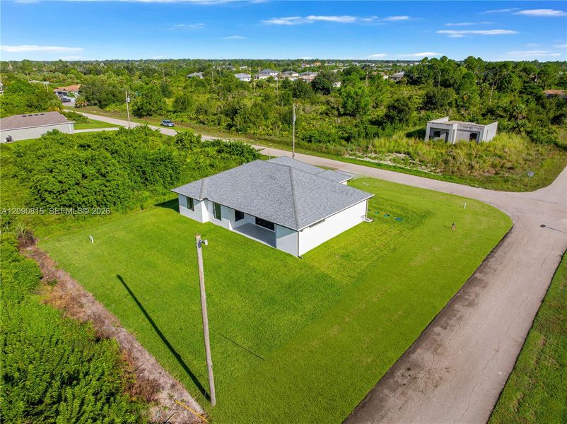 Front exterior of a new home in , Lehigh Acres, FL, highlighting curb appeal (Image 24).
