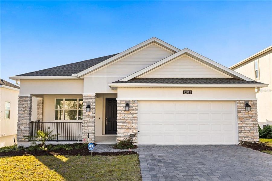 Front exterior of a new home in Dora Parc, Mount Dora, FL, highlighting curb appeal (Image 30).