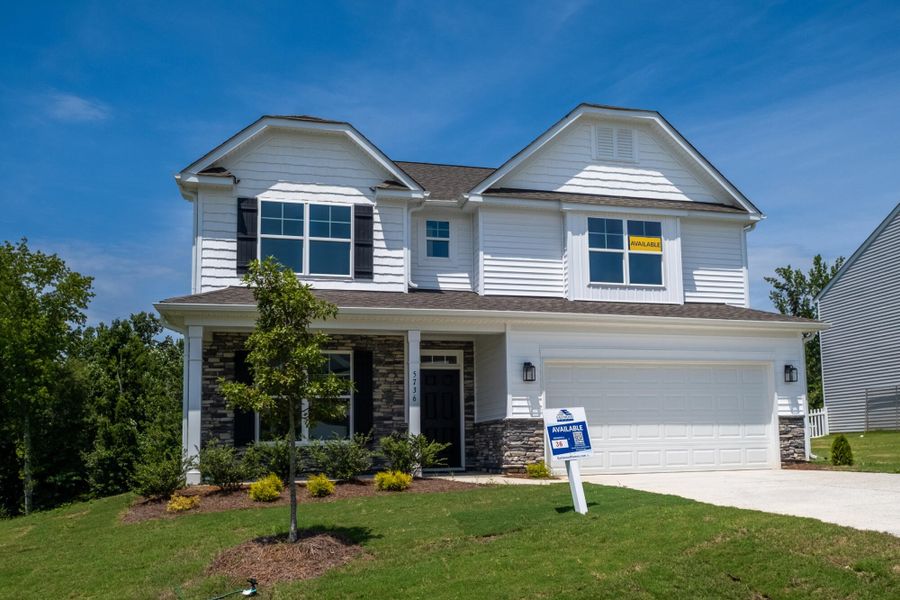 Front exterior of a new home in Cottages at Piper Village, Trinity, NC, highlighting curb appeal (Image 2). Front exterior of a new home in Cottages at Piper Village, Trinity, NC, highlighting curb appeal (Image 2).