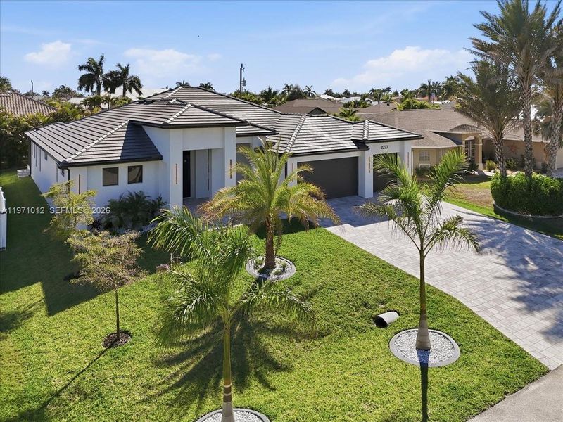 Front exterior of a new home in , Cape Coral, FL, highlighting curb appeal (Image 23).