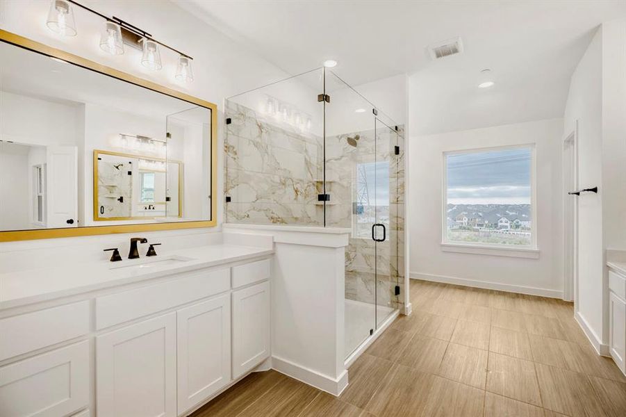 White vanity with dual sinks, quartz countertop, and matte black fixtures