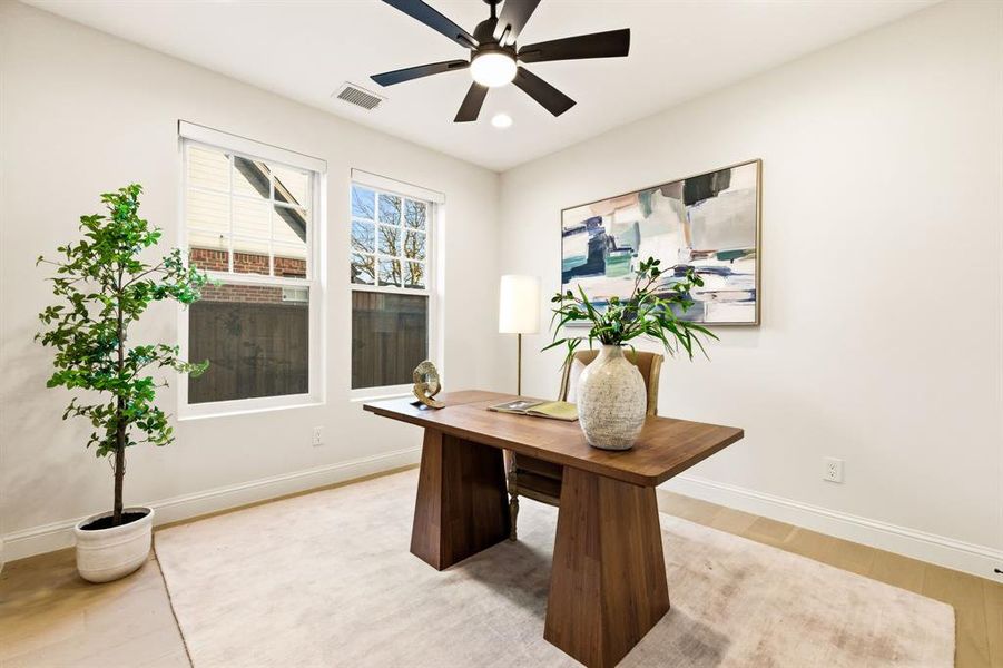Office space with ceiling fan, light wood-type flooring, and recessed lighting