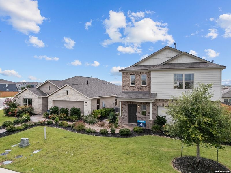 Front exterior of a new home in Winding Brook, San Antonio, TX, highlighting curb appeal (Image 22).
