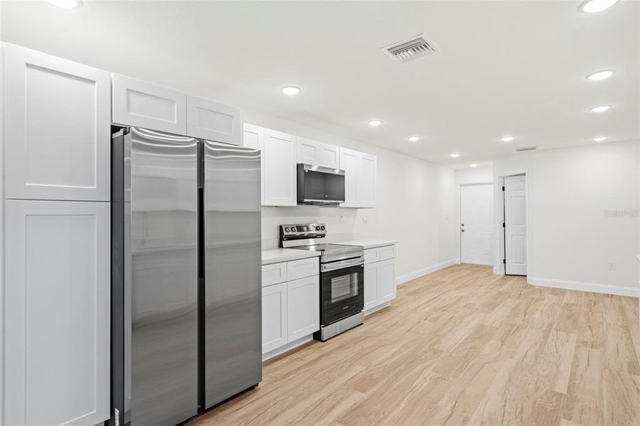 Furnished interior view inside a new home in , Okeechobee (Image 6).