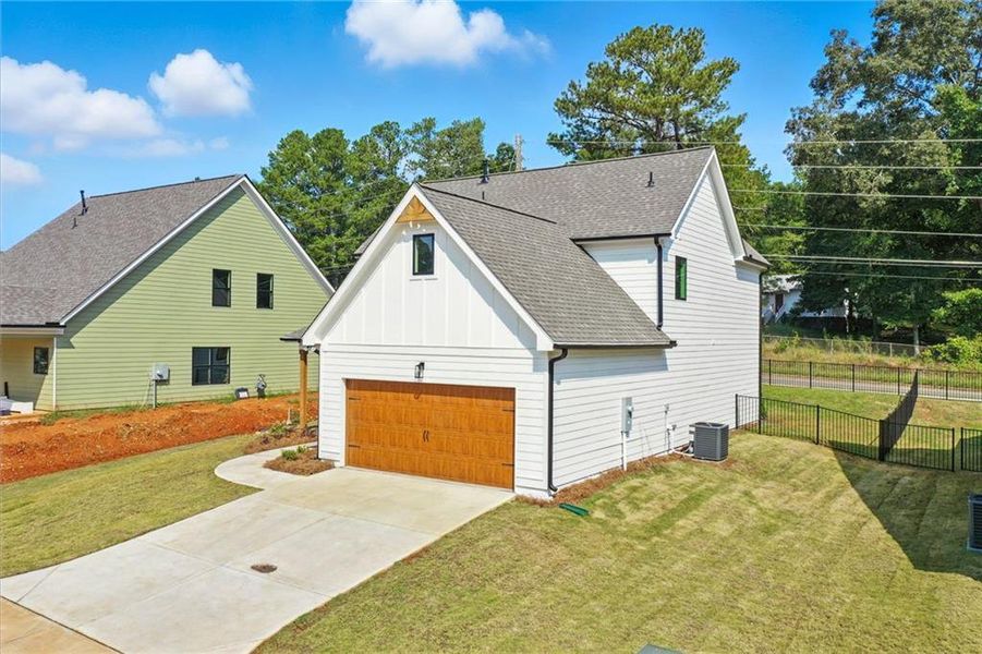 Front exterior of a new home in , Emerson, GA, highlighting curb appeal (Image 16).