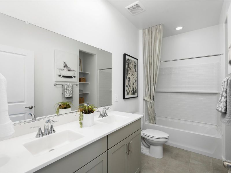 Enjoy dual sinks and built in storage in the second bathroom. Enjoy dual sinks and built in storage in the second bathroom.