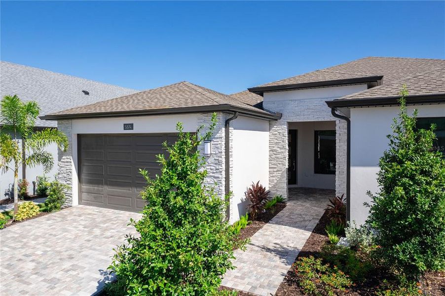 Front exterior of a new home in , Apollo Beach, FL, highlighting curb appeal (Image 19).