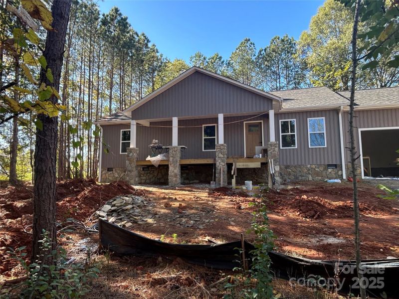Front porch with steps and concrete walkway to driveway