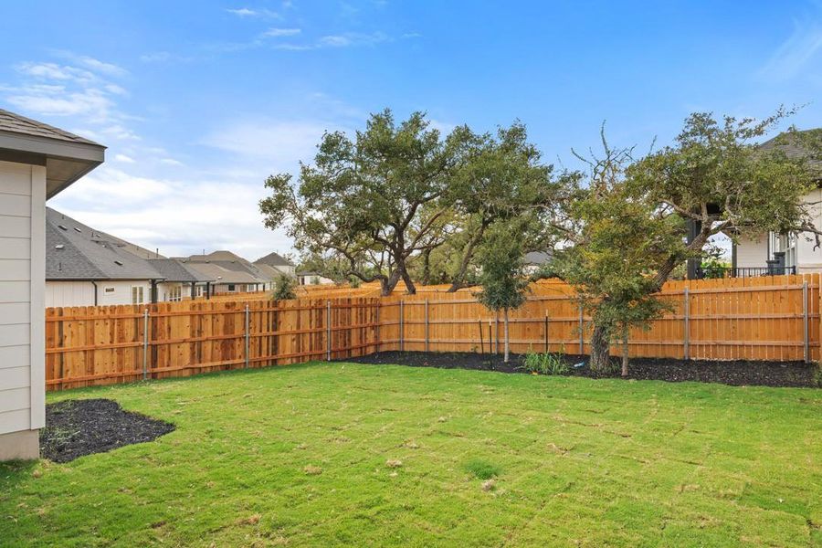 Exterior details and patio area of a home in Heritage, Dripping Springs (Image 26).