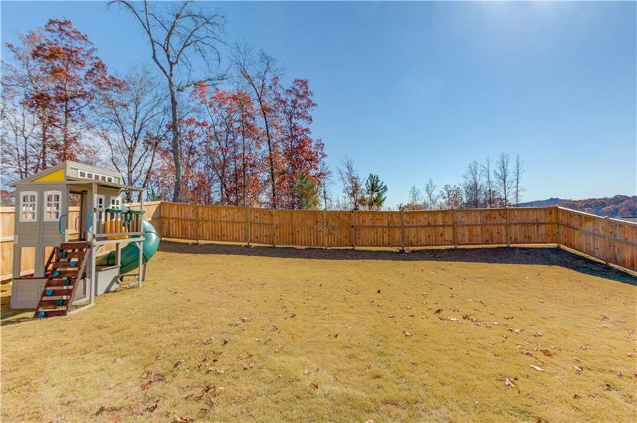 Exterior details and patio area of a home in Cambridge, Flowery Branch (Image 24).
