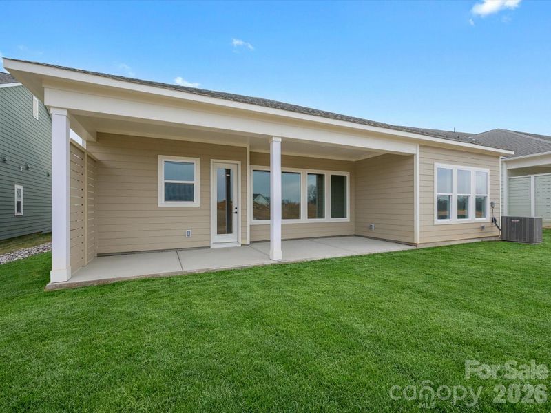 Exterior details and patio area of a home in Encore at Streamside - Tradition Series, Waxhaw (Image 3).