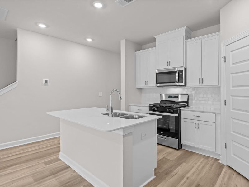 Furnished interior view inside a new home in Crossing at Abner Creek Townes, Greer (Image 5).