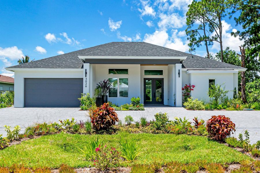 Front exterior of a new home in , Port St. Lucie, FL, highlighting curb appeal (Image 1).