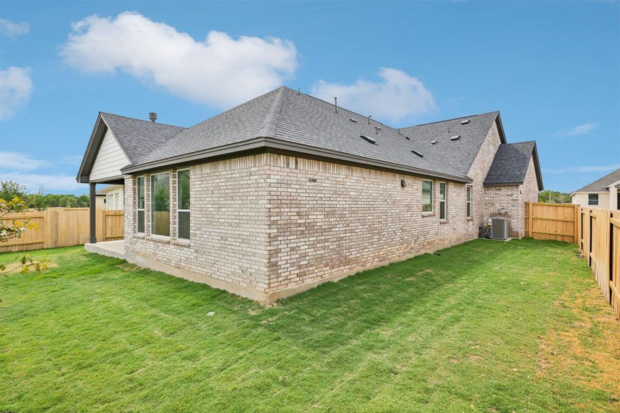 Exterior details and patio area of a home in Persimmon, Buda (Image 17).