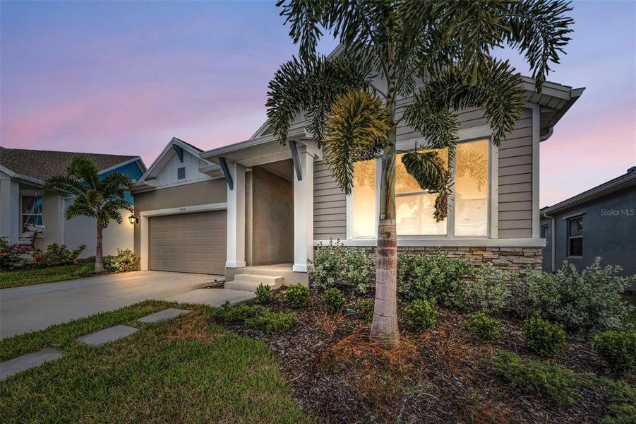 Front exterior of a new home in Eagle Creek - Garden Series, Tarpon Springs, FL, highlighting curb appeal (Image 20).