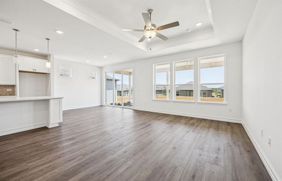 Open concept gathering room creating a spacious and inviting atmosphere *Real home pictured Open concept gathering room creating a spacious and inviting atmosphere *Real home pictured