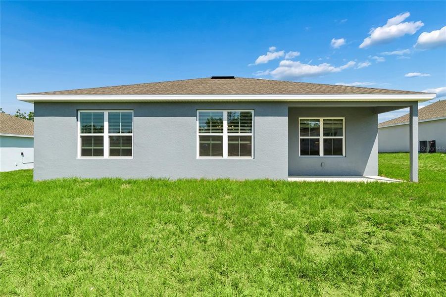 Exterior details and patio area of a home in Aspire at The Pines, Dunnellon (Image 19).