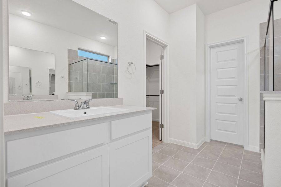 Primary Bath in the Elm home plan by Trophy Signature Homes – REPRESENTATIVE PHOTO