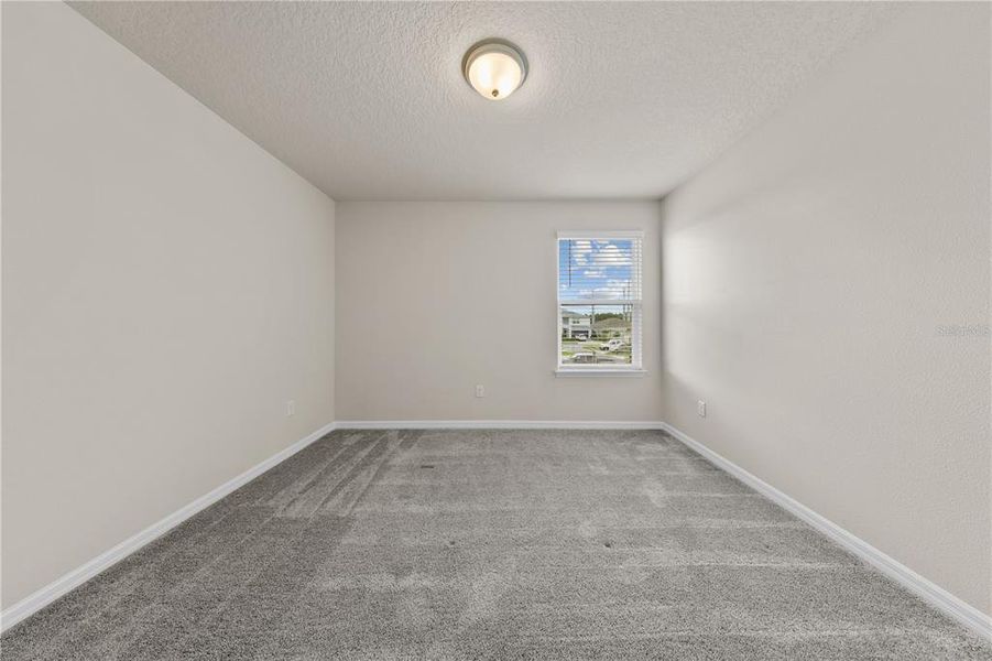 Spacious, unfurnished interior of a new home in EverBe, Orlando (Image 17).