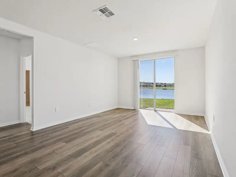 Spacious, unfurnished interior of a new home in Villamar - Signature Series, Winter Haven (Image 8).