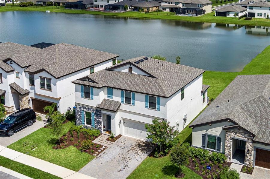 Front exterior of a new home in Crosswind Point, Parrish, FL, highlighting curb appeal (Image 22).