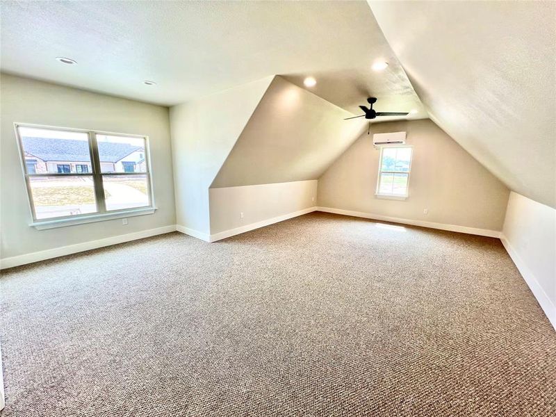 Upstairs bonus room or flex space above the 3 car garage 29x20