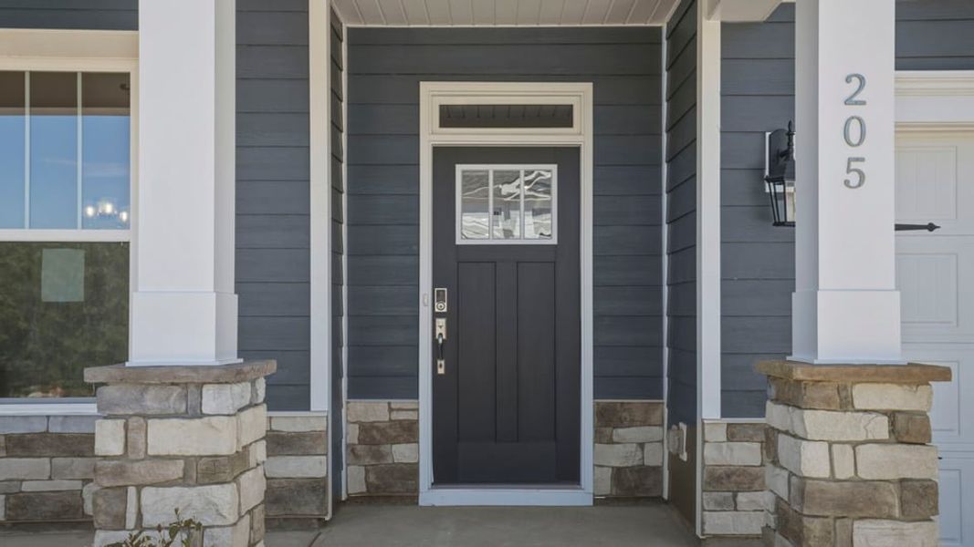 Exterior details and patio area of a home in Whitehawk Meadows, Travelers Rest (Image 2). Exterior details and patio area of a home in Whitehawk Meadows, Travelers Rest (Image 2).