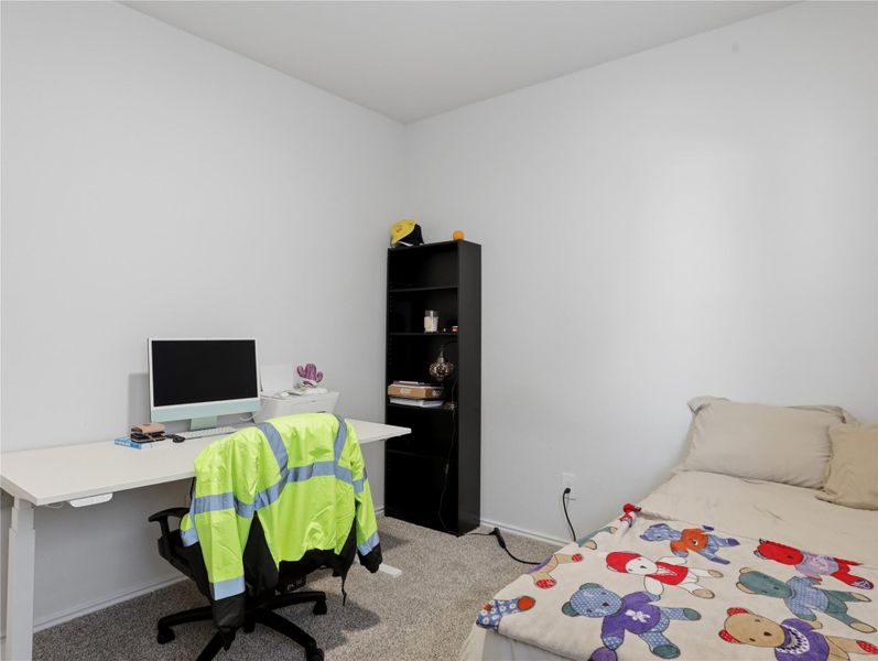 Plush carpeting anchors this versatile room, ideal as a bedroom or dedicated workspace. Plush carpeting anchors this versatile room, ideal as a bedroom or dedicated workspace.