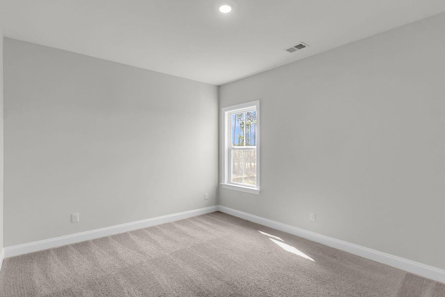 Spacious, unfurnished interior of a new home in Tidewater at Lakes of Cane Bay, Summerville (Image 18).