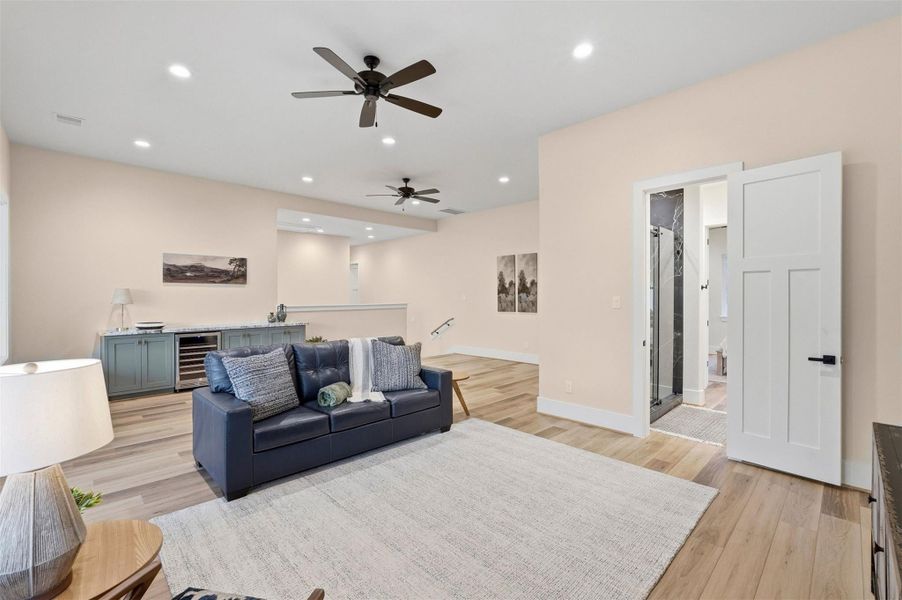 Oversized Game Room Features a Bar and Sitting Area with Room For A Pool or Ping Pong Table