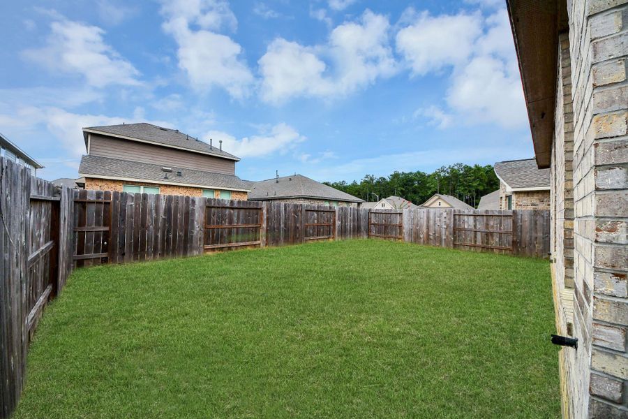 Exterior details and patio area of a home in The Trails, New Caney (Image 26).