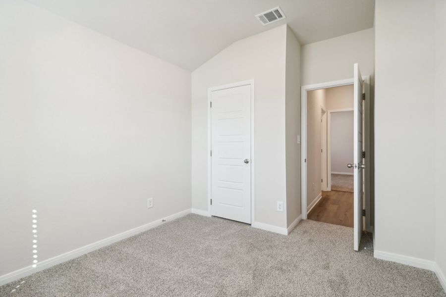 Guest bedroom in the Briscoe floorplan at a Meritage Homes community.