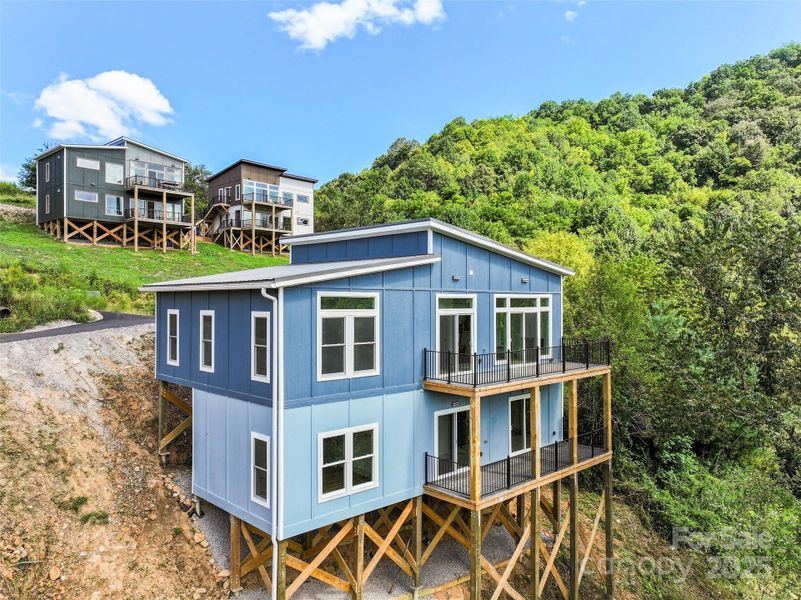Front exterior of a new home in , Waynesville, NC, highlighting curb appeal (Image 12).