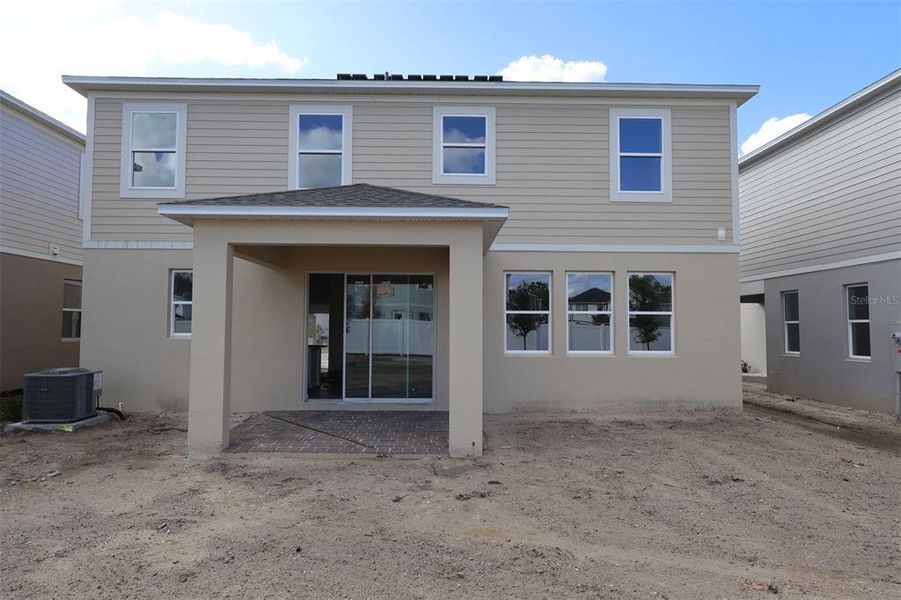 Exterior details and patio area of a home in Estates at Rivercrest, Sanford (Image 14). Exterior details and patio area of a home in Estates at Rivercrest, Sanford (Image 14).